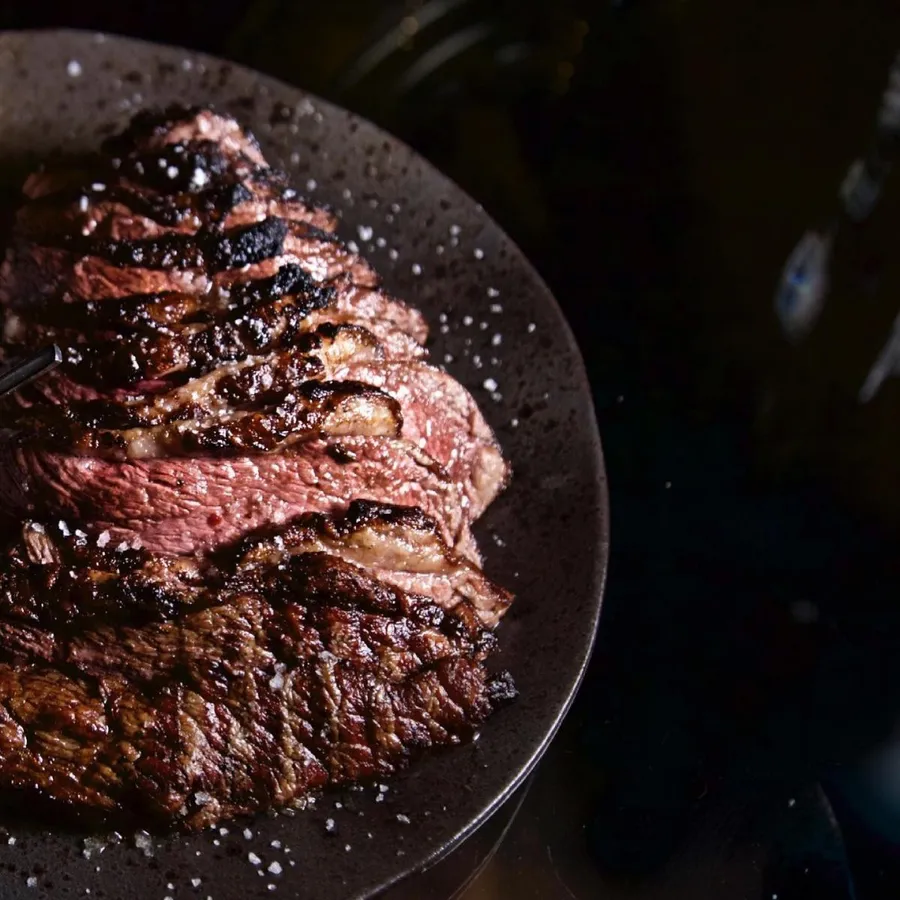 Sliced steak, char-grilled and finished with sea salt